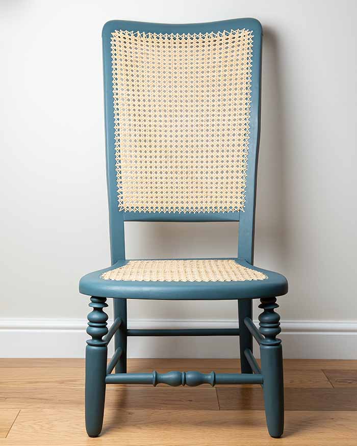 Bent-wood rocking chair with caned seat and back