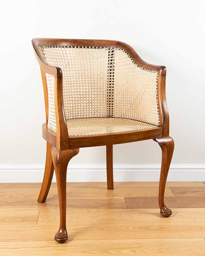 Bent-wood rocking chair with caned seat and back